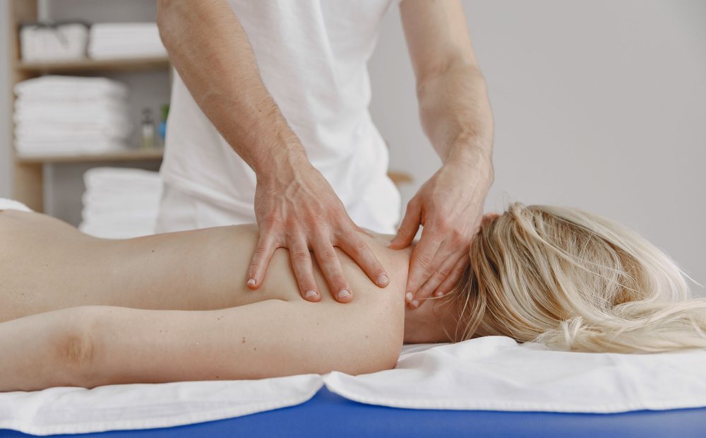 Registered massage therapist providing deep tissue treatment